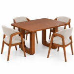 Teakora solid teak dining set with four upholstered chairs on a white background