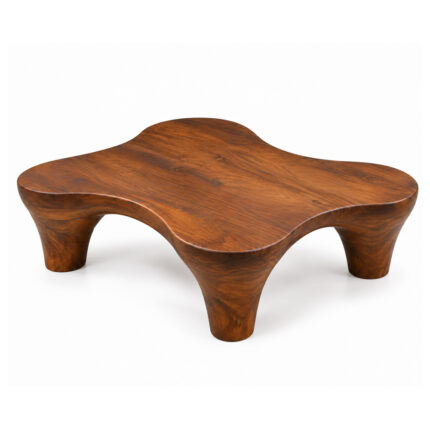 Top view showing the flowing organic shape and wood grain of the teak coffee table