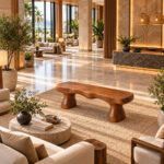 Organic suar wood bench positioned on a rug in a spacious hotel lobby
