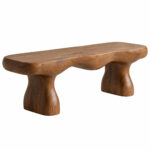 Top view of the Terra suar wood bench highlighting its elongated organic seat and natural grain
