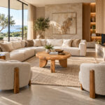 Trivana solid Suar wood round coffee table styled in a contemporary living room with a neutral sofa