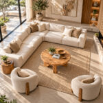 Elevated view of the Trivana round Suar wood coffee table in a contemporary lounge with a neutral rug and seating