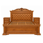 Ornate carved headboard and button tufted upholstered panel on Valdoria Imperial teak bed
