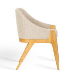 Side profile of a solid teak upholstered dining chair with curved backrest and tapered legs