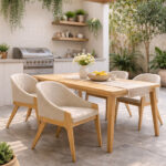 Scandinavian teak dining armchairs with upholstered seats and backs around a wooden dining table