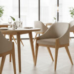 Scandinavian teak dining chair with beige upholstery paired with a natural solid wood dining table