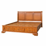 Windsor teak wood bed with three footboard drawers styled in a warm classic bedroom