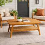 Teak wood coffee table with rattan shelf in modern living room