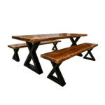 Front view of X-Forge Suar wood dining table set with two matching benches and black metal legs