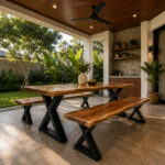 Angled view of X-Forge Suar wood dining table and two benches with black powder-coated X-frame legs