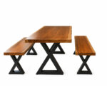 Side view of X-Forge solid Suar wood dining table and two matching benches with X-frame metal legs